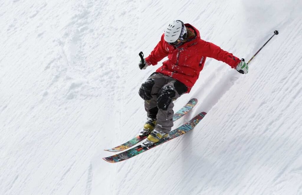 Skier wearing a knee brace on a snowy slope