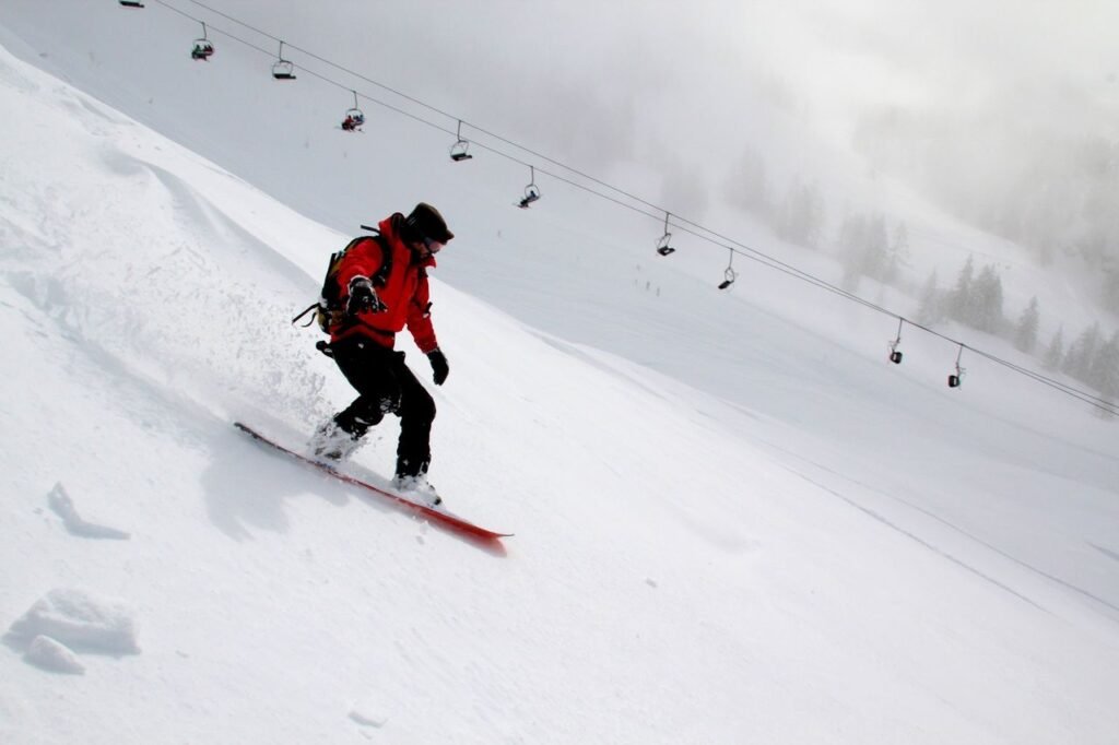 Skiers with knee braces preparing to descend a mountain