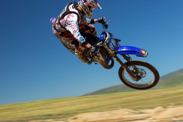 Motocross knee braces supporting joints during a jump